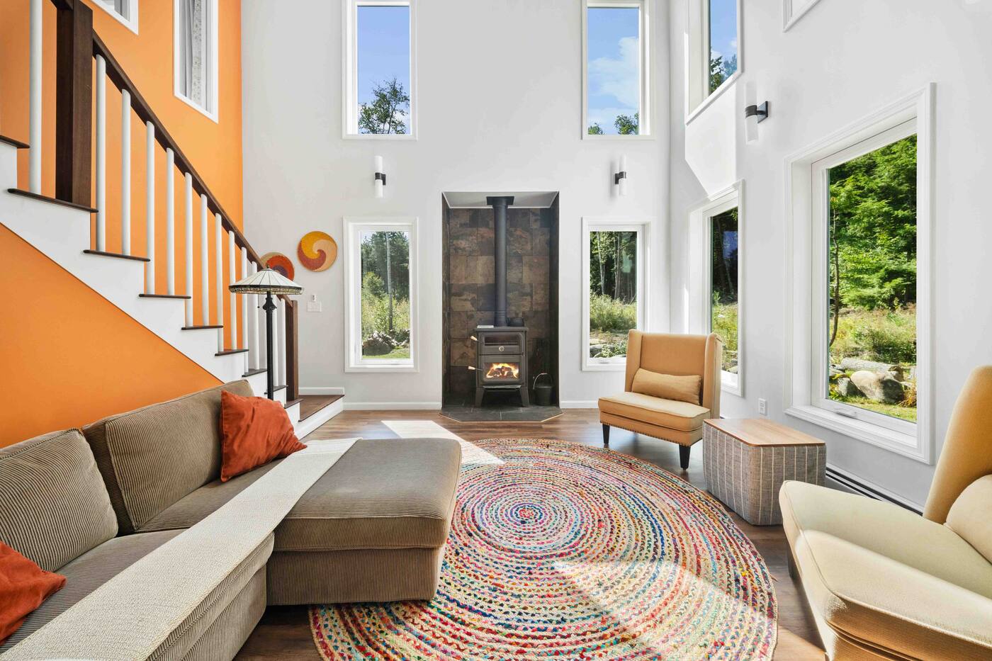 Vaulted-ceiling living room with wood stove and skylights