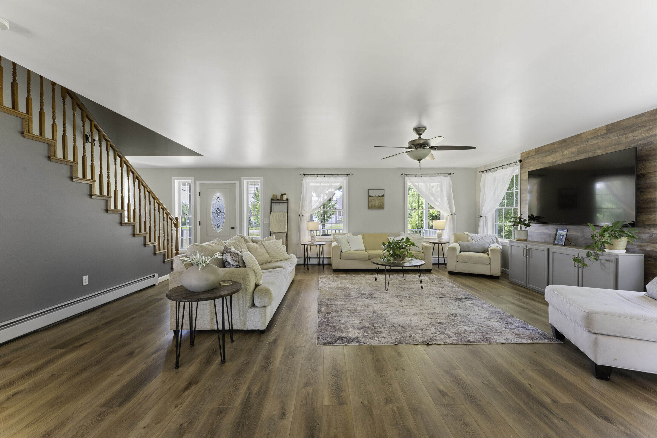 Open-concept kitchen and dining area with hardwood floors